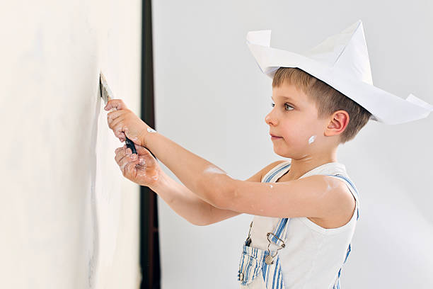 istock Little boy painting his room 536312969