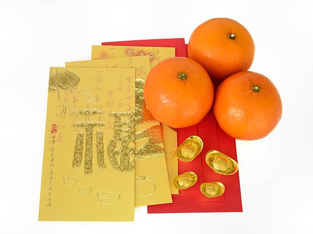 Red packets with oranges on white background stock photo