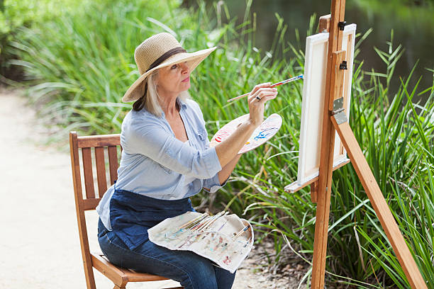 istock Artist painting nature on canvas 536313713