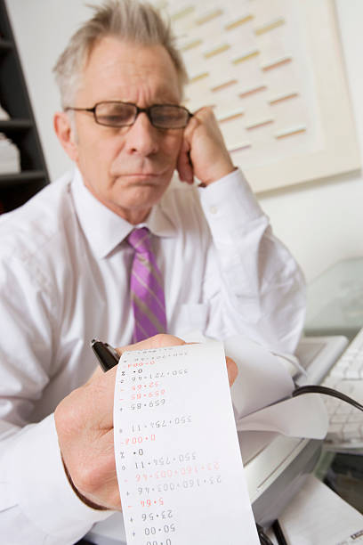 istock Senior Businessman Holding Expense Print 536314779