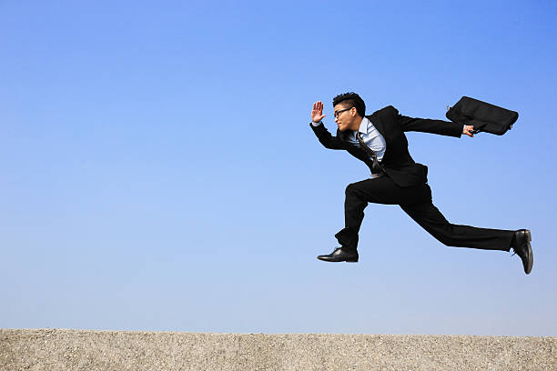 istock Happy business man jump 536315089
