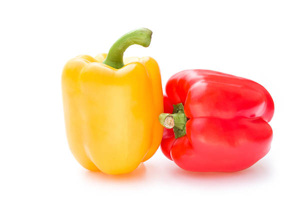 istock yellow and red bell peppers on a white background 536315837