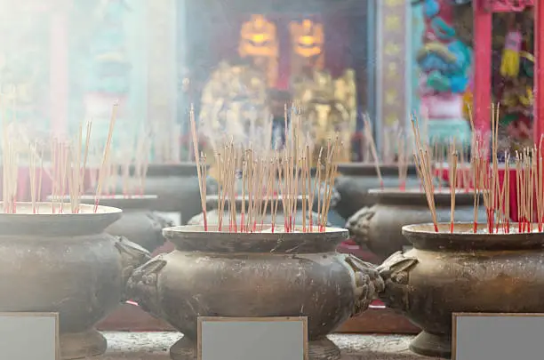 Burning incense in pot soft focus at Chinese temple