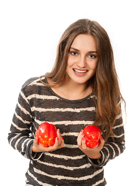 istock Woman with two red bell peppers 536353419