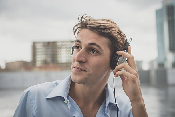 istock young model hansome blonde man with headphones 536353585