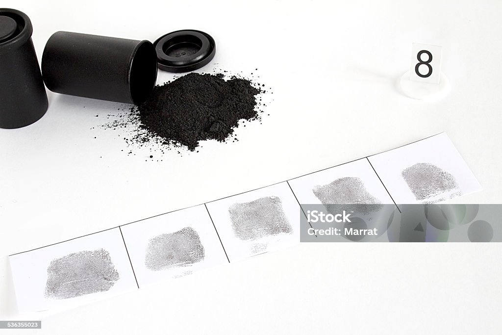 Dactyloscopy and black dust Dactyloscopy and fingerprint on the sheet of papper 2015 Stock Photo
