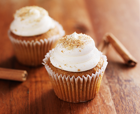 cinnamon chai cupcakes on wooden table top