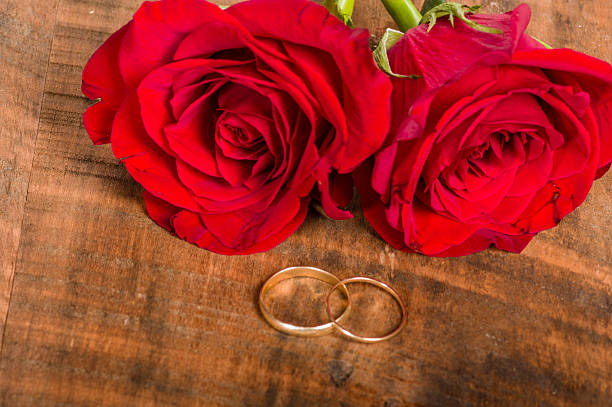istock Gold bands on wooden table 536356933