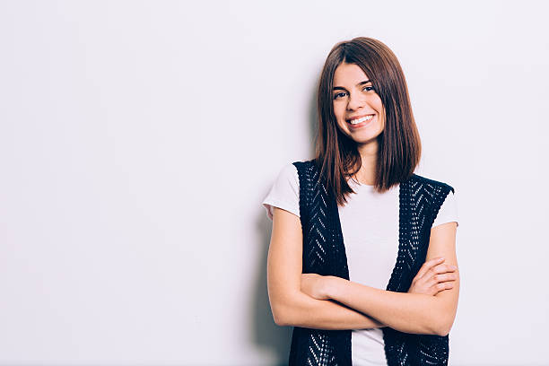 istock Confident brunette leaning against the wall 536357129