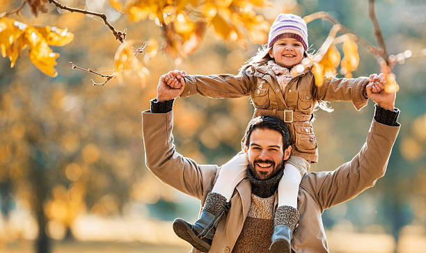 istock Smiling father and daughter having fun in autumn. 536402235