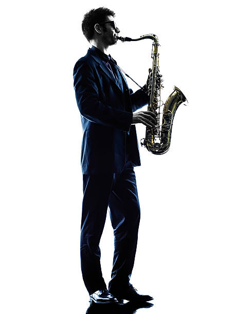 istock man saxophonist playing saxophone player  silhouette 536402651