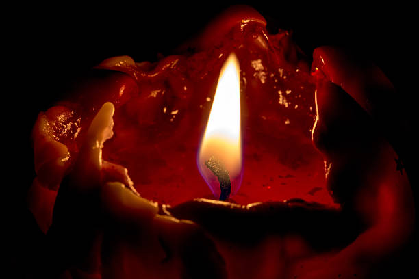 istock closeup macro of light on candle 536402805