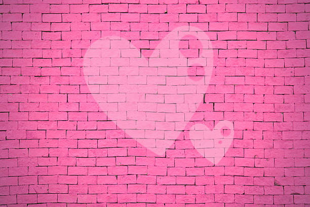 istock brick wall graffiti heart, valentines day background 536402909