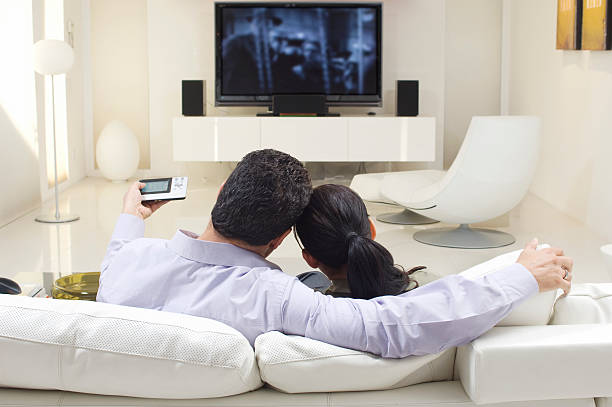 istock Couple On Sofa Watching TV 536403691