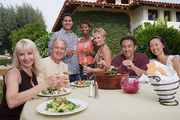 istock Friends Enjoying Dinner Party In Garden 536403703