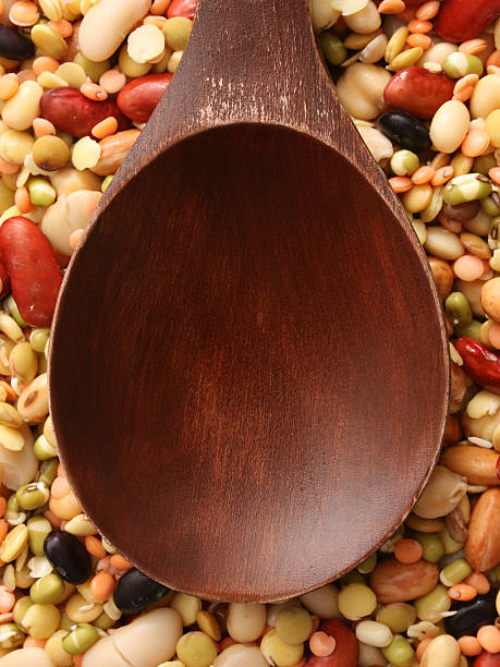 istock Empty wooden spoon over soaked legumes 536405345