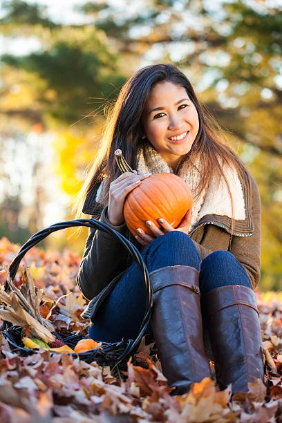 istock Young Asian woman at the park 536405691