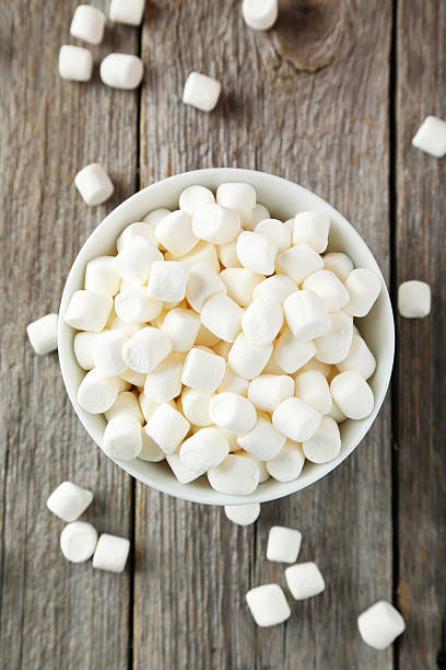 istock Marshmallows in bowl on grey wooden background 536405809