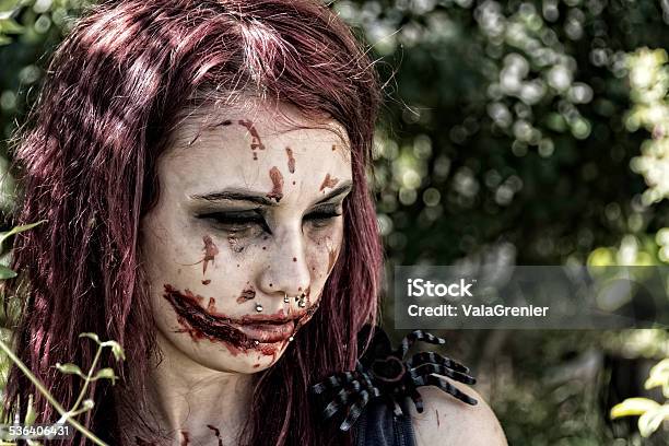 Zombie Girl Looking Away Slightly Desaturated With Spider Stock Photo - Download Image Now