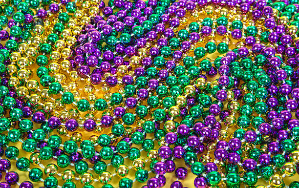 Mardi Gras beads Colorful Mardi Gras beads background bead stock pictures, royalty-free photos & images