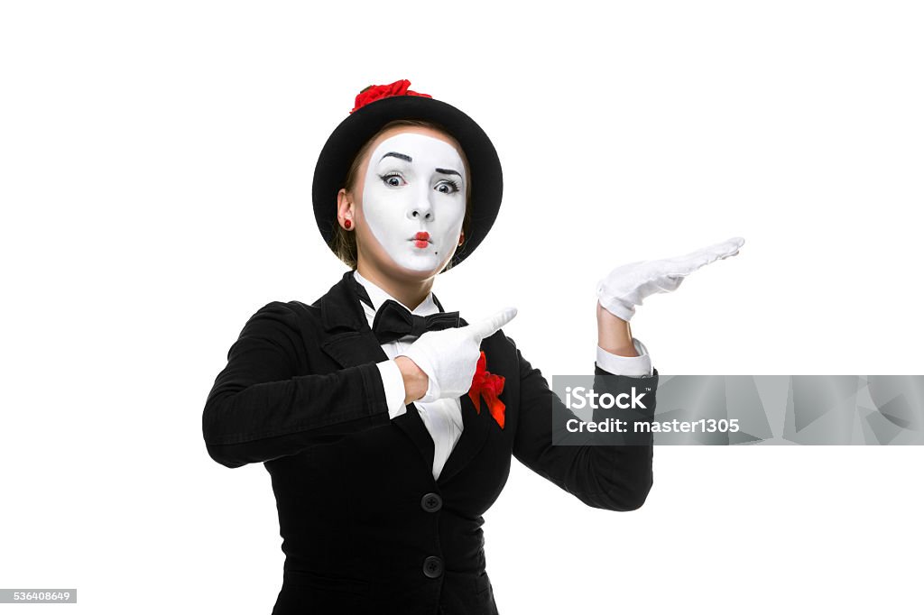 Portrait of the surprised mime Portrait of the surprised woman as mime isolated on white background. Concept of approval and recommendations 2015 Stock Photo