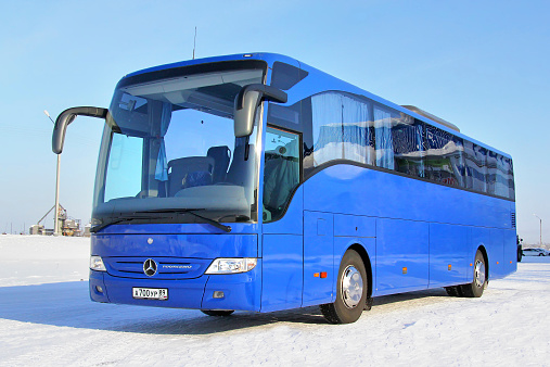 Novyy Urengoy, Russia - March 8, 2014: Blue Mercedes-Benz O350RHD Tourismo interurban coach parked at the city street.