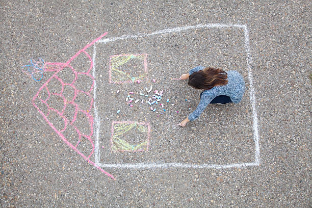 istock Girl draws a house 536409821