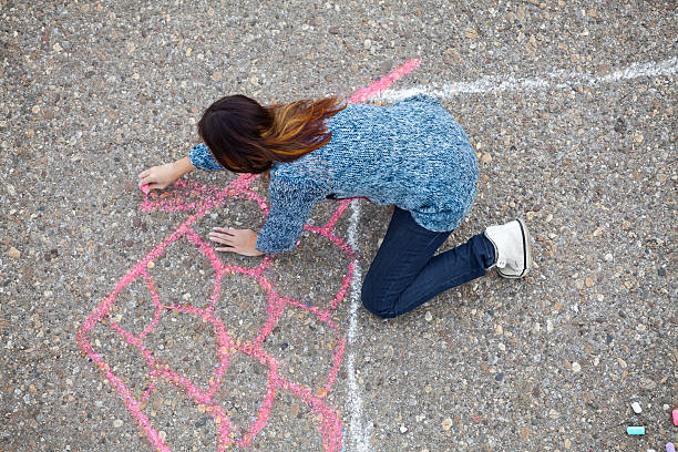 istock Girl draws a house 536454689