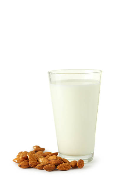 istock Glass of milk with almonds isolated on white 536455253