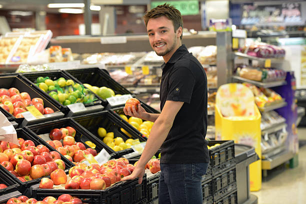 istock One young man shopping in a supermarket 536456587