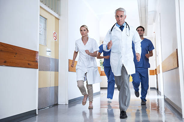 Nurse Rummimg 50+ Female Nurse Running Stock Photos, Pictures & Royalty-Free Images ...