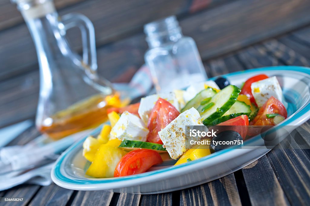 fresh salad fresh greek salad on plate and on a table 2015 Stock Photo