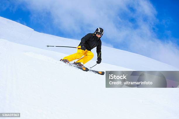 Winter Sport Senior Men Skier Skiing On Sunny Ski Resorts Stock Photo - Download Image Now