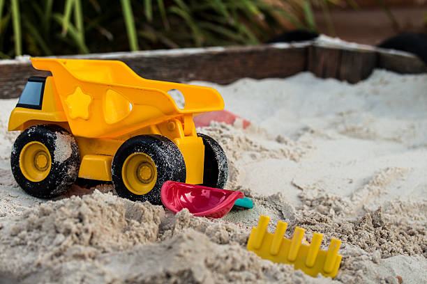 Sand pit with toys stock photo