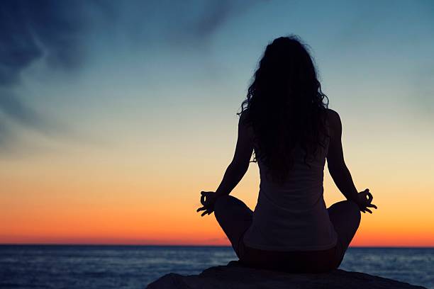 istock Yoga meditation at sunset 536461693