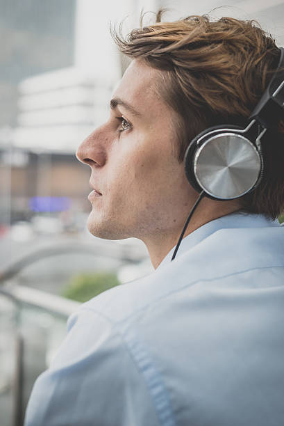istock young model hansome blonde man with headphones 536504635