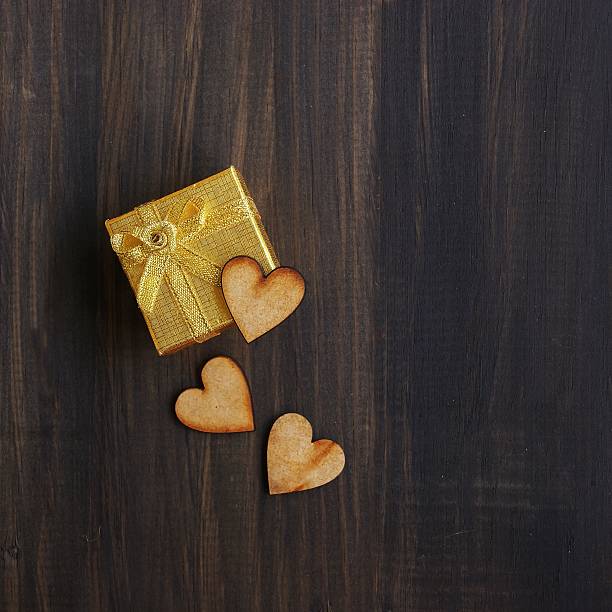 istock Wooden hearts on a present box 536506977