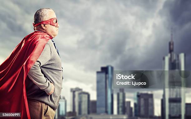 Senior Superhero Standing In Front Of A City Stock Photo - Download Image Now - Senior Adult, Superhero, Heroes