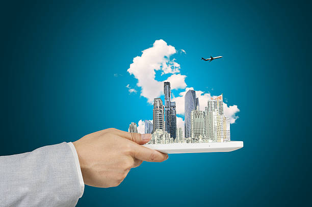 istock Male Hand Hold tablet with Moderncity 536507097