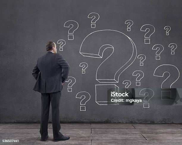Businessman And Question Marks Stock Photo - Download Image Now - Question Mark, Chalkboard - Visual Aid, Problems
