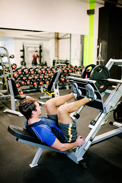 istock Using a leg press, weight training equipment in the gym 536507519