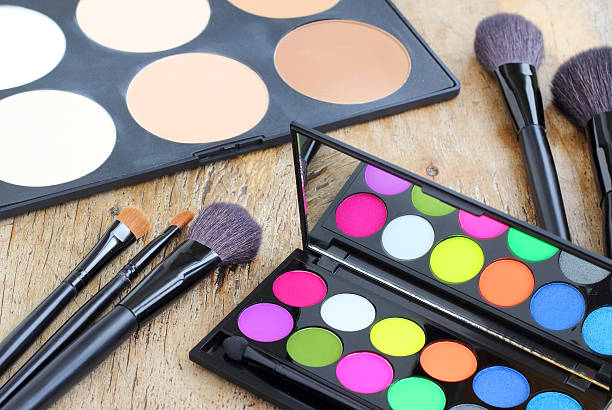 istock Makeup brushes make-up eye shadows vintage wooden background 536507635