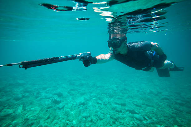 Young man fishing whit speargun