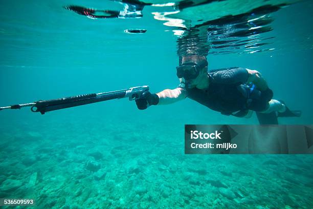 Young Man Fishing Whit Speargun Stock Photo - Download Image Now - Fishing, Underwater, Hunting - Sport
