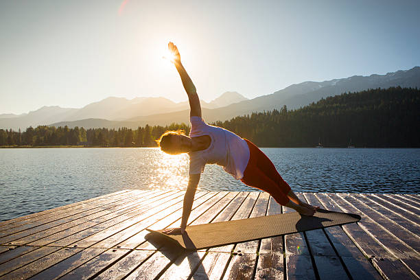 Yoga on lake stock photo