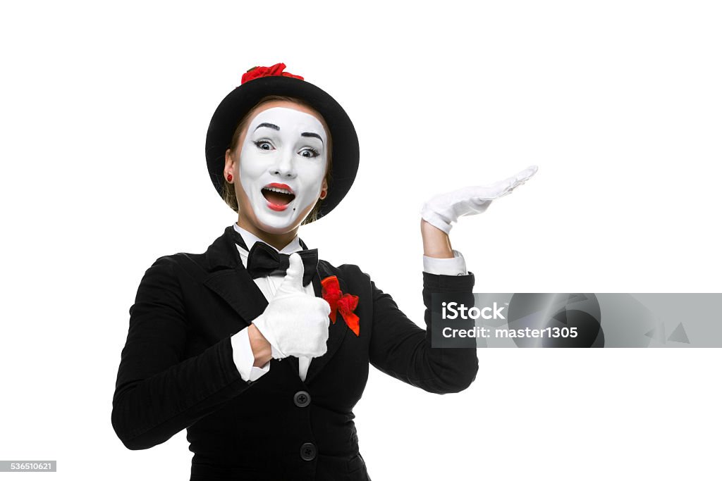 Portrait of the surprised and joyful mime Portrait of the surprised and joyful woman as mime isolated on white background. Concept of approval and recommendations 2015 Stock Photo