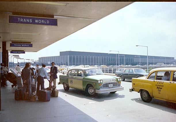 The entrance to Departure Terminal, O'Hare Airport, Chicago 1980 Chicago, IL, USA - April 1, 1980: Taxis set down passengers outside the departure terminal at O'Hare Airport porter photos stock pictures, royalty-free photos & images