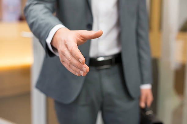 istock Businessman giving a hand in office 536553323