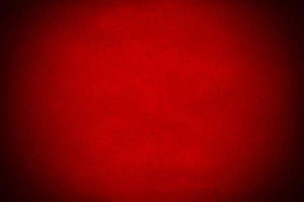 istock Abstract red background with bright center spotlight 536553325