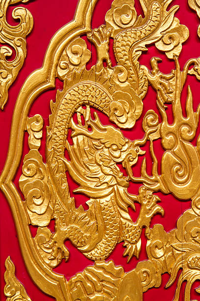 istock Golden dragon decorated on red wood wall 536554295
